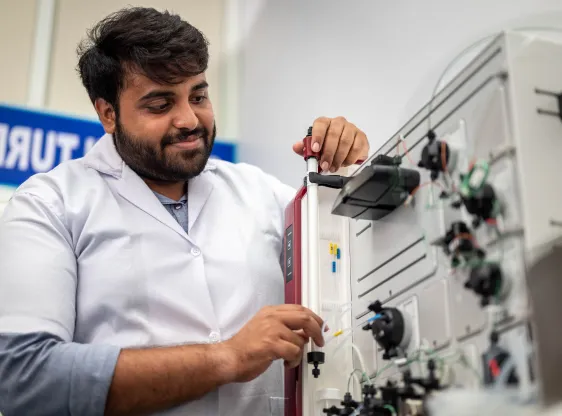 GITAM researcher operating laboratory instrumentation